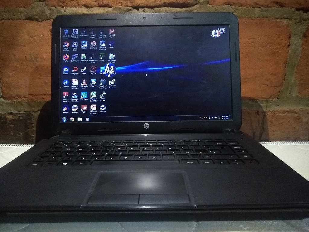 A photo of a laptop booted to a Windows 7 desktop