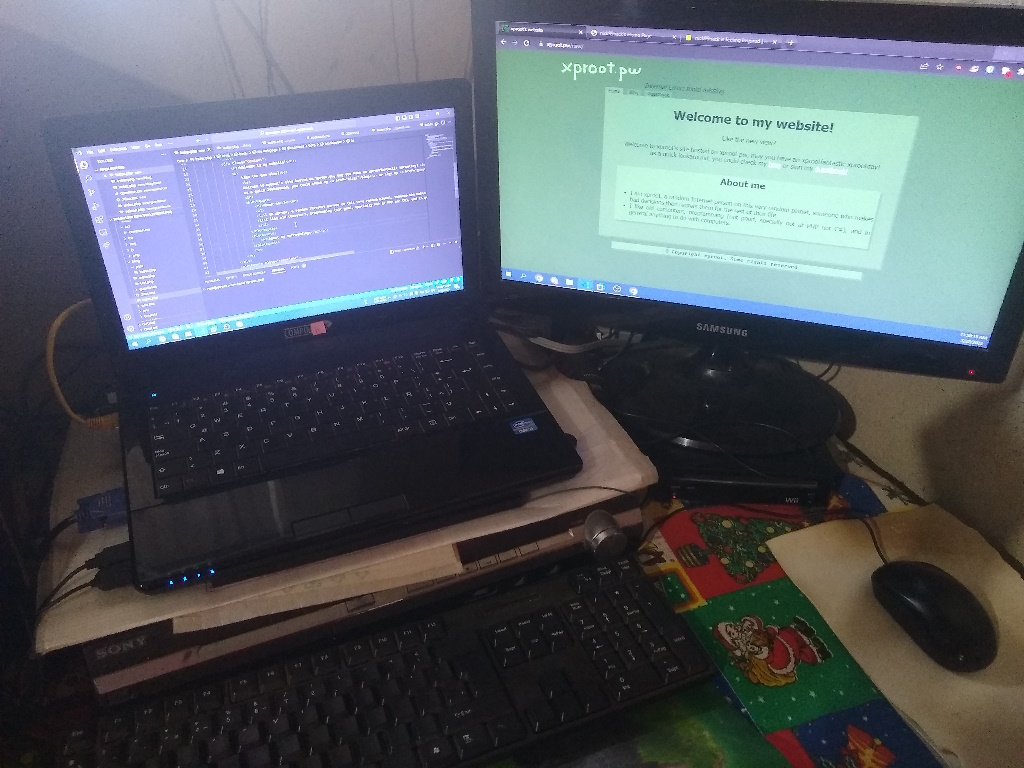 A photo of a laptop connected to a USB keyboard and mouse, connected to the Internet via Ethernet, and connected to a external monitor using VGA